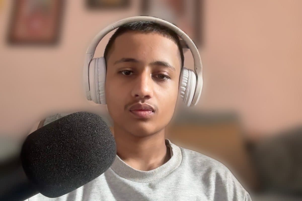 Codezen Regmi, founder of Creovel, with headphones and a microphone